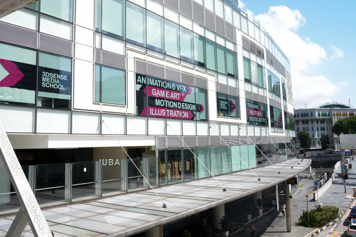 The glass exterior of The Central at Clarke Quay, with 3dsense Media School signage.