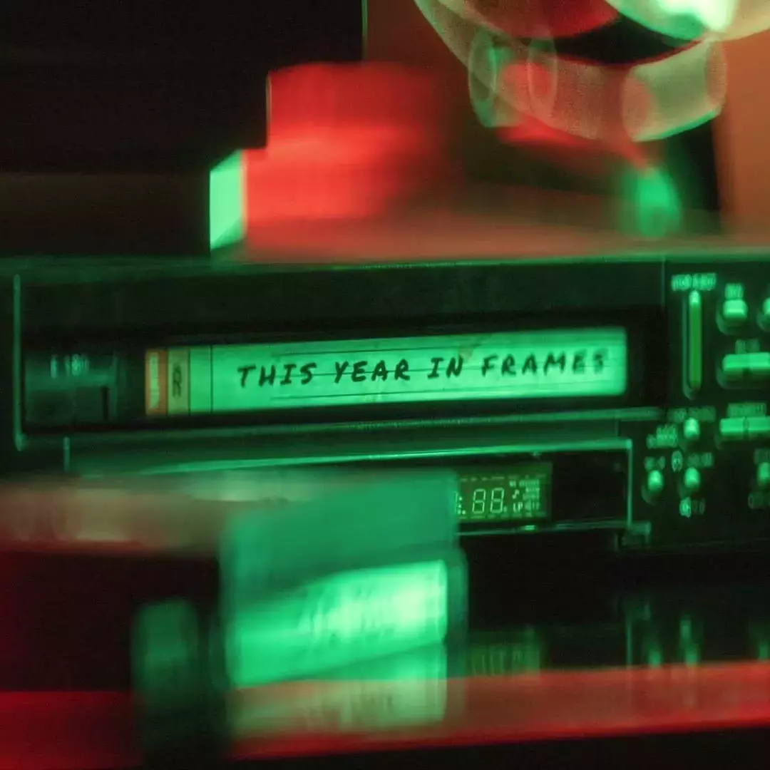 A close-up of a video cassette player with a tape labeled 